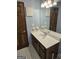 Main bathroom with single vanity, shower/tub combo and decorative tile at 2531 Quentin Dr, Jonesboro, GA 30236