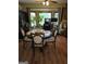 Bright dining room with a round table and four chairs, overlooking a wooded area at 2531 Quentin Dr, Jonesboro, GA 30236