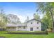 Back of house with large yard, featuring a spacious patio and detached garage at 648 Overlook Ct, Jonesboro, GA 30238