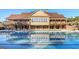 Community pool with clubhouse reflection at 3290 Stock Saddle Pl, Cumming, GA 30040
