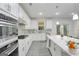 Modern kitchen with white cabinets, stainless steel appliances, and an island at 3290 Stock Saddle Pl, Cumming, GA 30040