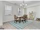 Elegant dining room with hardwood floors and a chandelier at 3290 Stock Saddle Pl, Cumming, GA 30040