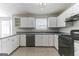 Modern kitchen with stainless steel appliances and gray countertops at 1125 Misty Meadows Ln, Hampton, GA 30228