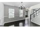 Spacious dining room featuring hardwood floors and elegant chandelier at 1125 Misty Meadows Ln, Hampton, GA 30228