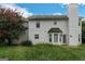 Rear view of a two story house with white siding at 1125 Misty Meadows Ln, Hampton, GA 30228