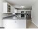 Modern kitchen with stainless steel appliances and gray countertops at 1125 Misty Meadows Ln, Hampton, GA 30228