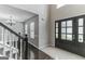 Two-story entryway with hardwood floors, staircase, and chandelier at 1125 Misty Meadows Ln, Hampton, GA 30228