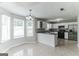Kitchen with adjacent dining area, gray countertops and stainless steel appliances at 1125 Misty Meadows Ln, Hampton, GA 30228