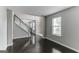 Spacious living room with hardwood floors and large windows at 1125 Misty Meadows Ln, Hampton, GA 30228