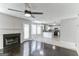 Open living room with kitchen view, fireplace and hardwood floors at 1125 Misty Meadows Ln, Hampton, GA 30228