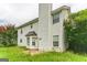 Two-story house with white siding and tall chimney at 1125 Misty Meadows Ln, Hampton, GA 30228