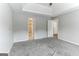 Main bedroom with carpet, access to bathroom and hallway at 1125 Misty Meadows Ln, Hampton, GA 30228