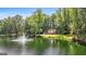 House on a pond with lush landscaping at 3110 Highway 20 W, Hampton, GA 30228