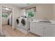 Laundry room with washer, dryer, and utility sink at 3110 Highway 20 W, Hampton, GA 30228