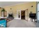 Sunroom with access to living area and TV at 3110 Highway 20 W, Hampton, GA 30228