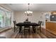 Dining room with chandelier, table, and chairs at 3110 Highway 20 W, Hampton, GA 30228