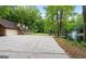 Ranch home with attached garage and a pond in the background at 3110 Highway 20 W, Hampton, GA 30228