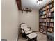 Cozy reading nook with a rocking chair and a full bookshelf at 3110 Highway 20 W, Hampton, GA 30228