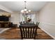 Bright dining room with hardwood floors and access to sunroom at 3110 Highway 20 W, Hampton, GA 30228