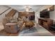 Living room with hardwood floors, comfy seating, and a view to sunroom at 3110 Highway 20 W, Hampton, GA 30228