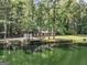 Ranch home on a pond with dock at 3110 Highway 20 W, Hampton, GA 30228