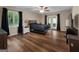 Large main bedroom with wood flooring and access to a patio at 3110 Highway 20 W, Hampton, GA 30228