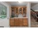 Built-in wet bar with glass-front cabinets and counter space at 3110 Highway 20 W, Hampton, GA 30228