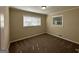 Bright bedroom with neutral walls, carpet flooring, and two windows with blinds at 3207 Cloverhurst Dr, East Point, GA 30344
