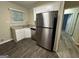 Modern kitchen with white cabinets, granite countertops, stainless steel appliances, and vinyl flooring at 3207 Cloverhurst Dr, East Point, GA 30344