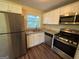 Updated kitchen with stainless steel appliances and granite countertops at 2213 Westover Dr, East Point, GA 30344