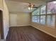 Bright living room with hardwood floors, large windows, and ceiling fan at 2213 Westover Dr, East Point, GA 30344