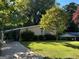 Charming ranch home with a well-maintained lawn and driveway at 2213 Westover Dr, East Point, GA 30344