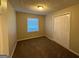 Cozy bedroom with carpet flooring and double door closet at 2213 Westover Dr, East Point, GA 30344