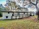 White brick ranch house with deck, landscaped yard, and large backyard at 2604 Favor Sw Rd, Marietta, GA 30060