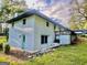 White brick house with a teal door and deck at 2604 Favor Sw Rd, Marietta, GA 30060