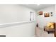 Upstairs hallway with seating area and decorative wall art at 1705 Labonte Pkwy, Mcdonough, GA 30253