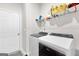 Laundry room with washer, dryer, and overhead shelving at 1705 Labonte Pkwy, Mcdonough, GA 30253