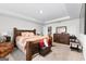 Spacious main bedroom with king-size bed and en-suite bathroom at 1705 Labonte Pkwy, Mcdonough, GA 30253