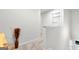 Bright hallway with carpeted flooring and access to bedrooms at 1705 Labonte Pkwy, Mcdonough, GA 30253