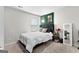 Bedroom with a queen bed and full-length mirror at 1705 Labonte Pkwy, Mcdonough, GA 30253