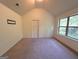 Bedroom with vaulted ceiling and large windows at 700 Emporia Loop, Mcdonough, GA 30253