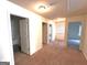 Bright hallway with doors to bedrooms and bathroom at 700 Emporia Loop, Mcdonough, GA 30253