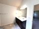 Bathroom features a double vanity and large mirror at 700 Emporia Loop, Mcdonough, GA 30253