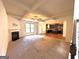 Open living room with kitchen view and cozy fireplace at 700 Emporia Loop, Mcdonough, GA 30253