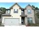 Two-story house with a large garage and brick facade at 700 Emporia Loop, Mcdonough, GA 30253