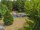 Gray house with large yard and wooded area, seen from above at 1142 Harbins Rd, Dacula, GA 30019