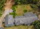 Aerial view of a long gray house with a large yard at 1142 Harbins Rd, Dacula, GA 30019