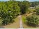 Aerial view of long driveway leading to a house at 1142 Harbins Rd, Dacula, GA 30019