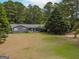 Gray house with large yard and wooded area, seen from above at 1142 Harbins Rd, Dacula, GA 30019