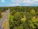 Aerial view of property with road and trees at 1142 Harbins Rd, Dacula, GA 30019
